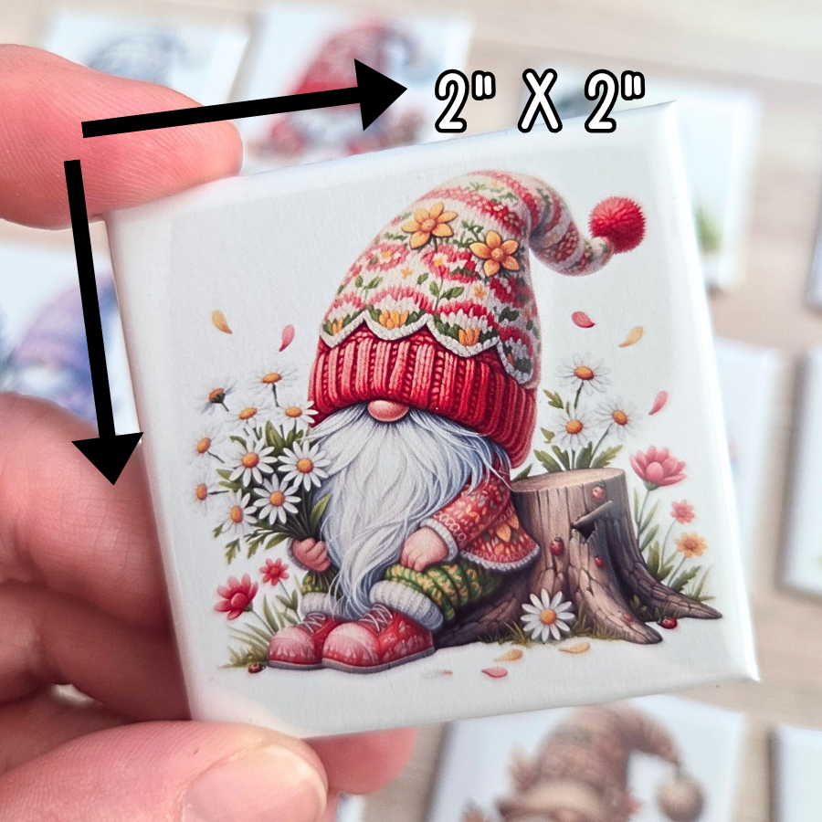 Small square Magnets with a gnome holding daisies, showing the size '2" x 2"'.