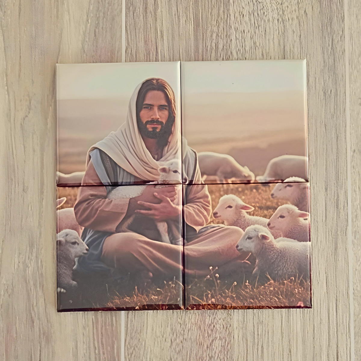 Magnet Puzzle of a Jesus Christ holding a lamb with sheep in the background on a wooden surface. It the Lamb of God puzzle for the Easter season.  show a tag that quotes the Scripture John 10:1 I am the Good Shepherd. The Good Shepherd giveth his life for the sheep.