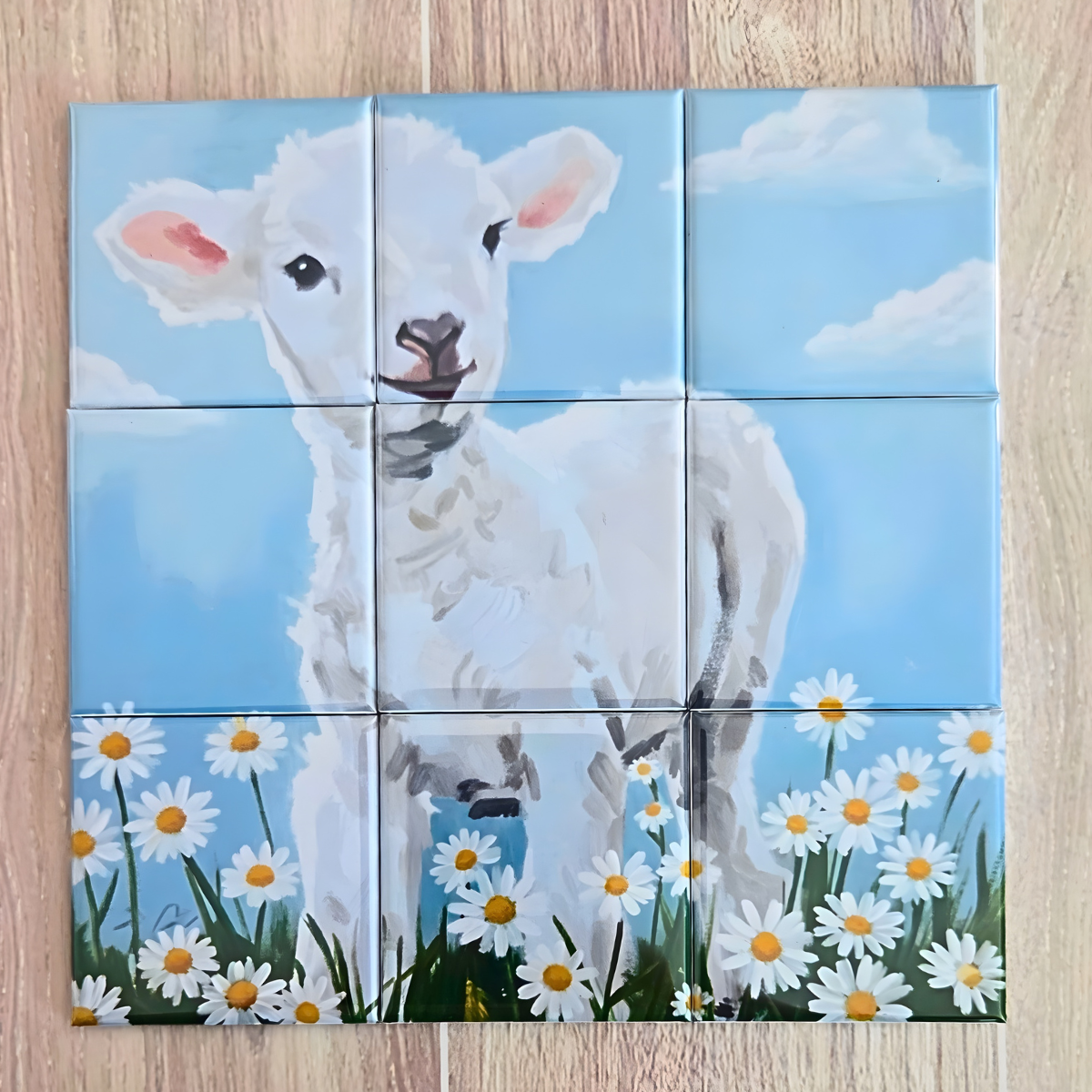 9‑piece magnetic Easter puzzle featuring a painted white lamb standing in a daisy field under a blue sky. Includes a floral drawstring gift bag and a brown tag that reads ‘It’s Not About the Bunny, It’s About the Lamb – Happy Easter.’ Faith‑based Easter gift, Christian lamb puzzle for kids and families.