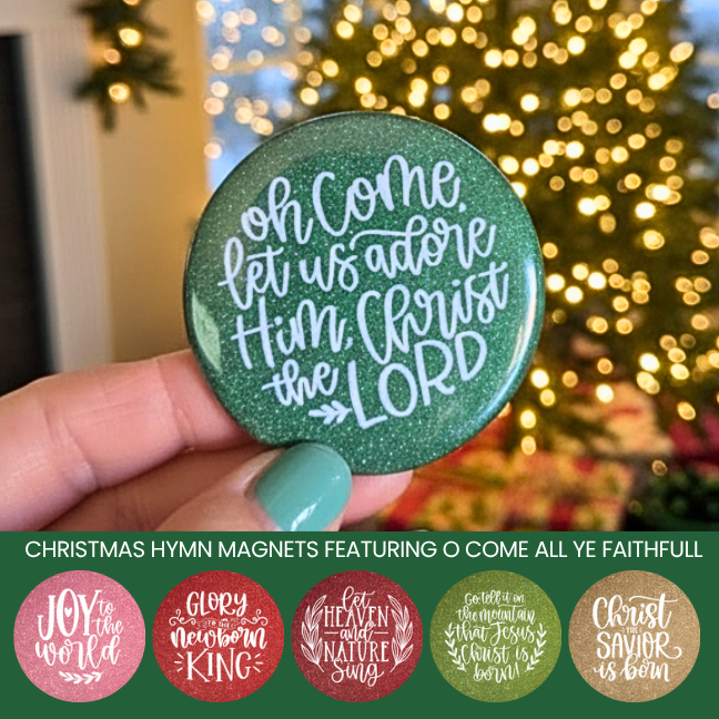 Green magnet with Christmas  hymn text held in front of a decorated Christmas tree.