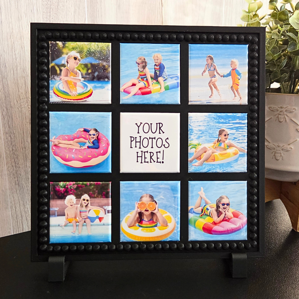 Black 3D‑printed 3×3 magnetic frame with a decorative beaded border, designed to hold nine photo magnets in a clean grid layout, shown with removable feet and clearly labeled as holding 9 photo magnets.