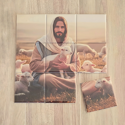 Magnet Puzzle of a Jesus Christ holding a lamb with sheep in the background on a wooden surface. It the Lamb of God puzzle for the Easter season.  show a tag that quotes the Scripture John 10:1 I am the Good Shepherd. The Good Shepherd giveth his life for the sheep.