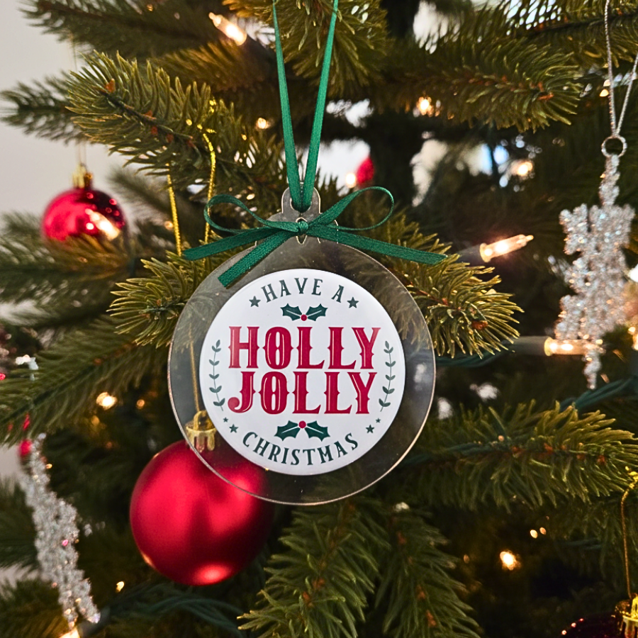Decorative Christmas ornament with 'Holly Jolly Christmas' text on a tree.