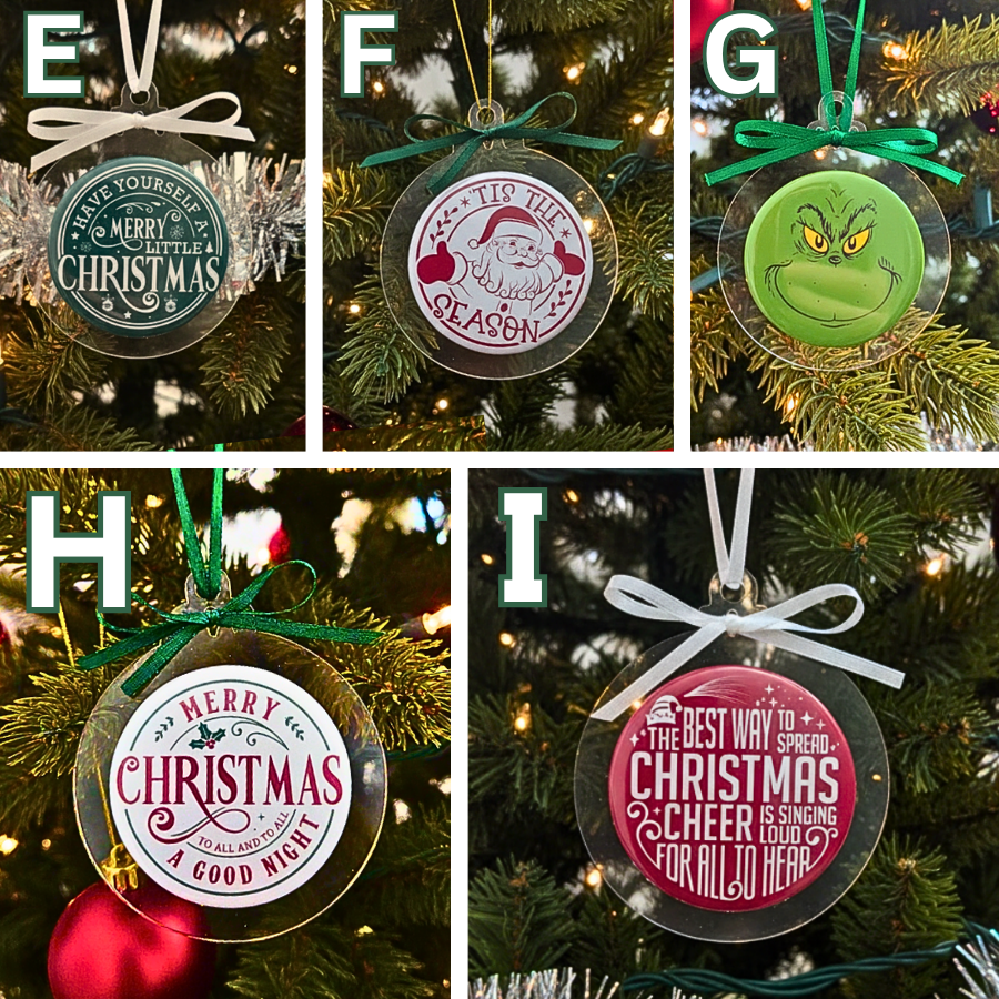 Set of Christmas-themed decorative ornaments on a tree.