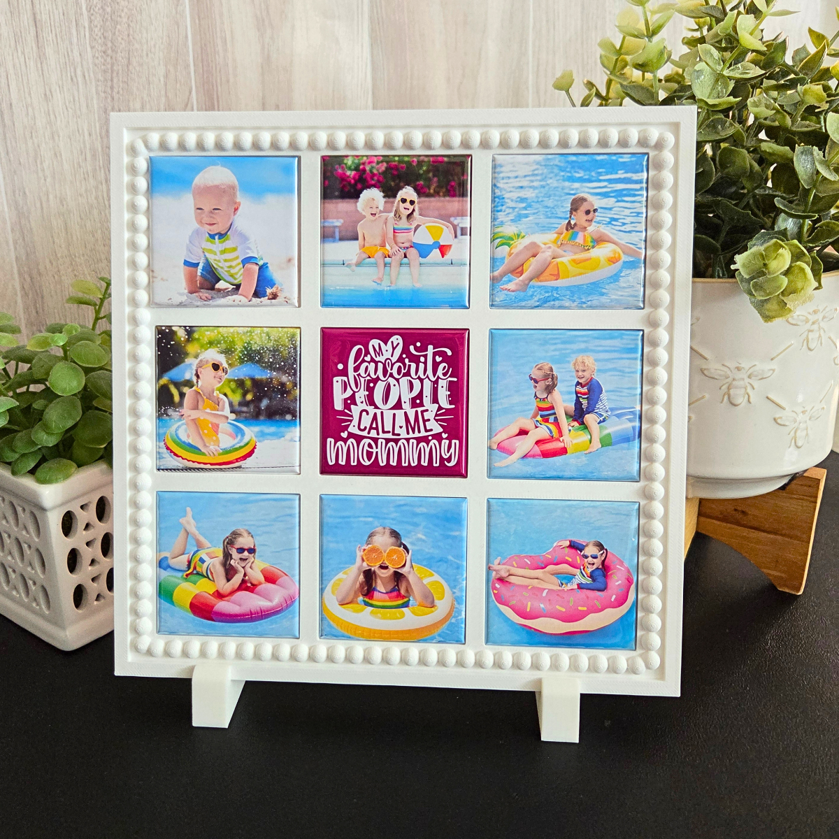 White photo frame with multiple photos of children on an inflatable pool toy, placed indoors for Mother's Day 