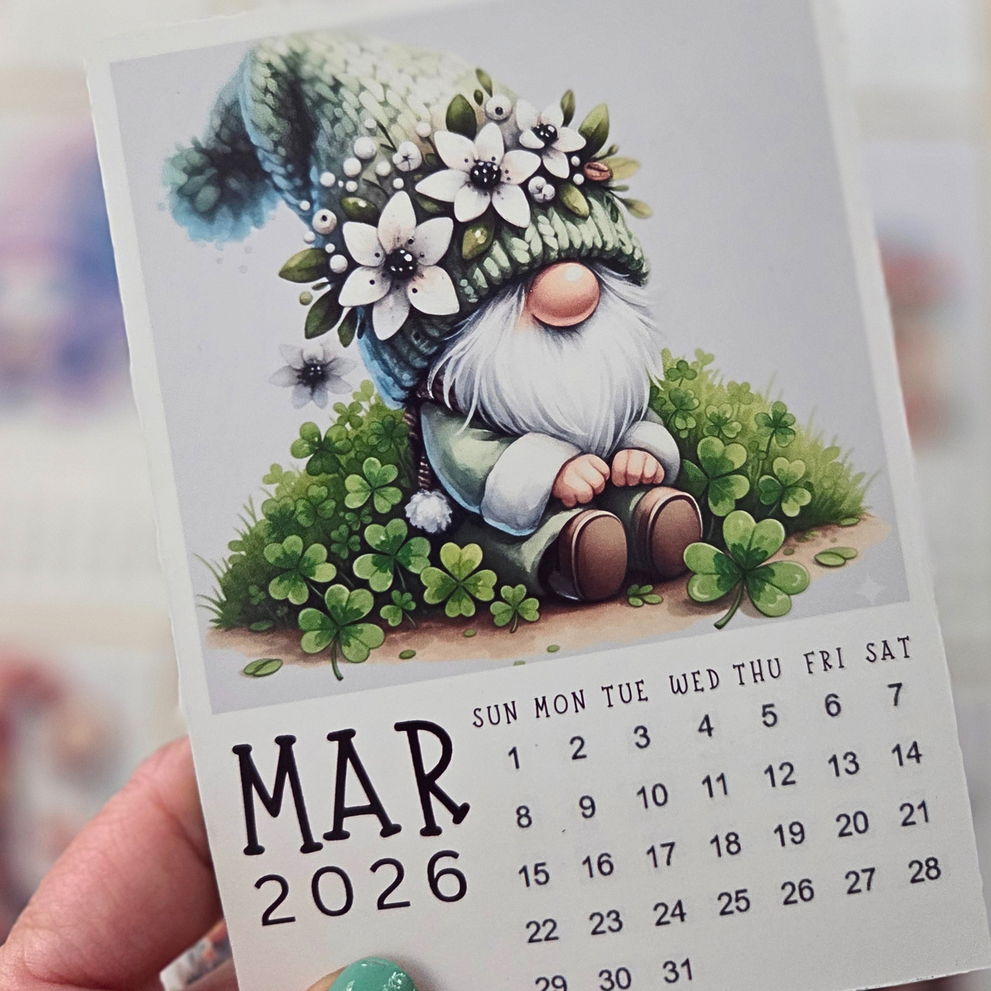 Calendar for March 2026 with a gnome illustration on a blurred background