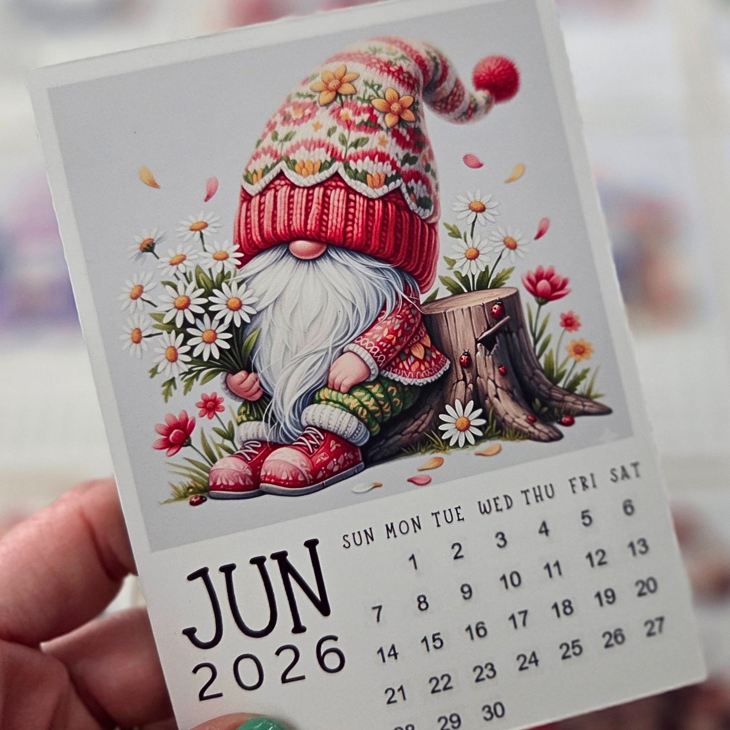 Calendar for June 2026 with a gnome illustration on a white background