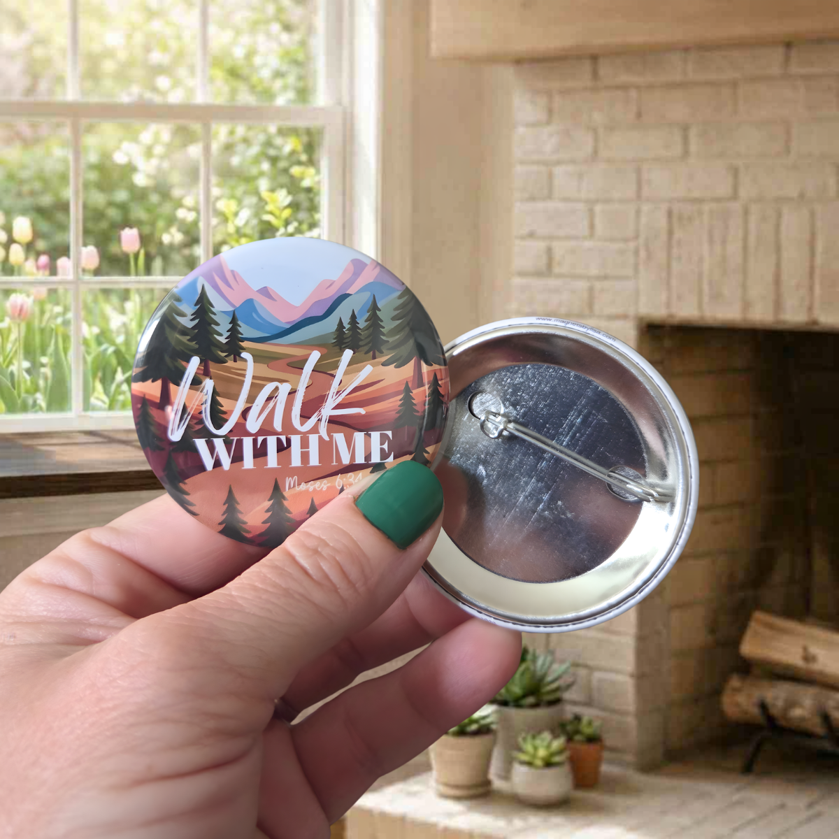 Button badge with 'Walk With Me' design held by a hand in a home setting.