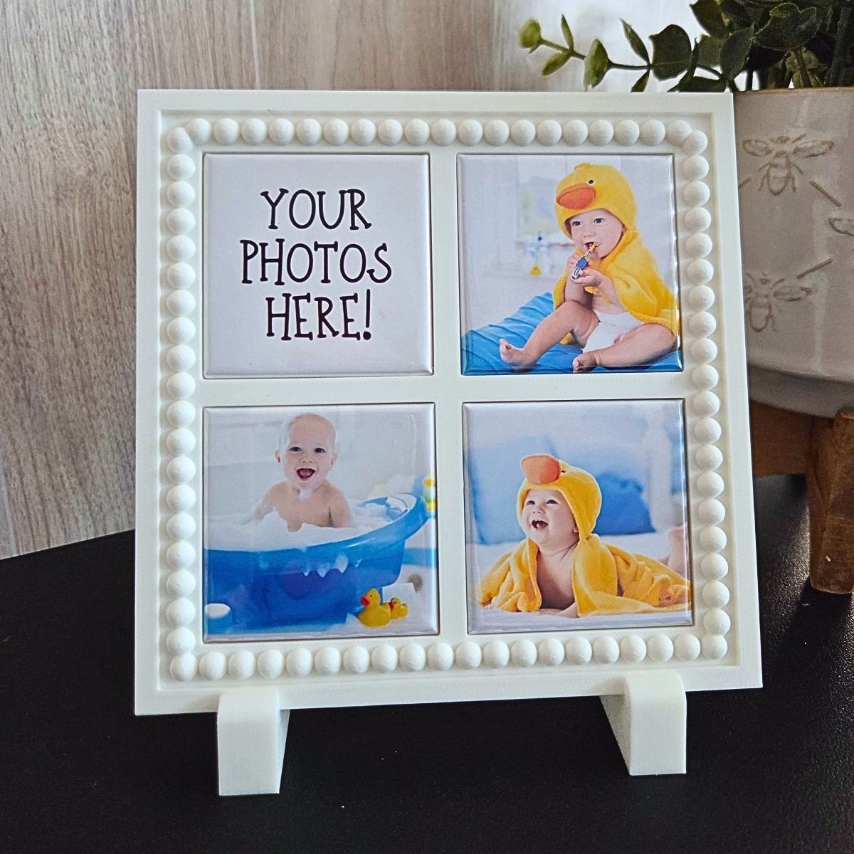 White 3D‑printed 2x2 magnetic frame with a decorative beaded border, designed to hold three photo magnets in portrait or landscape orientation, shown with removable feet.