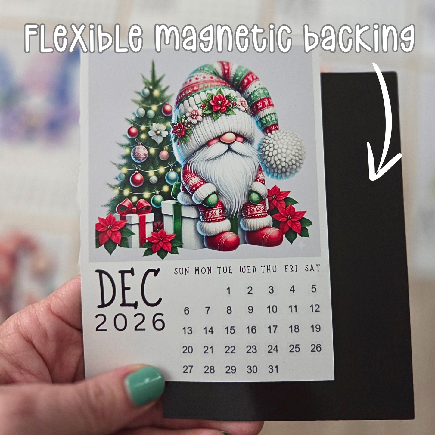 Calendar for December 2026 with a Christmas gnome design with Christmas tree, held by a hand.