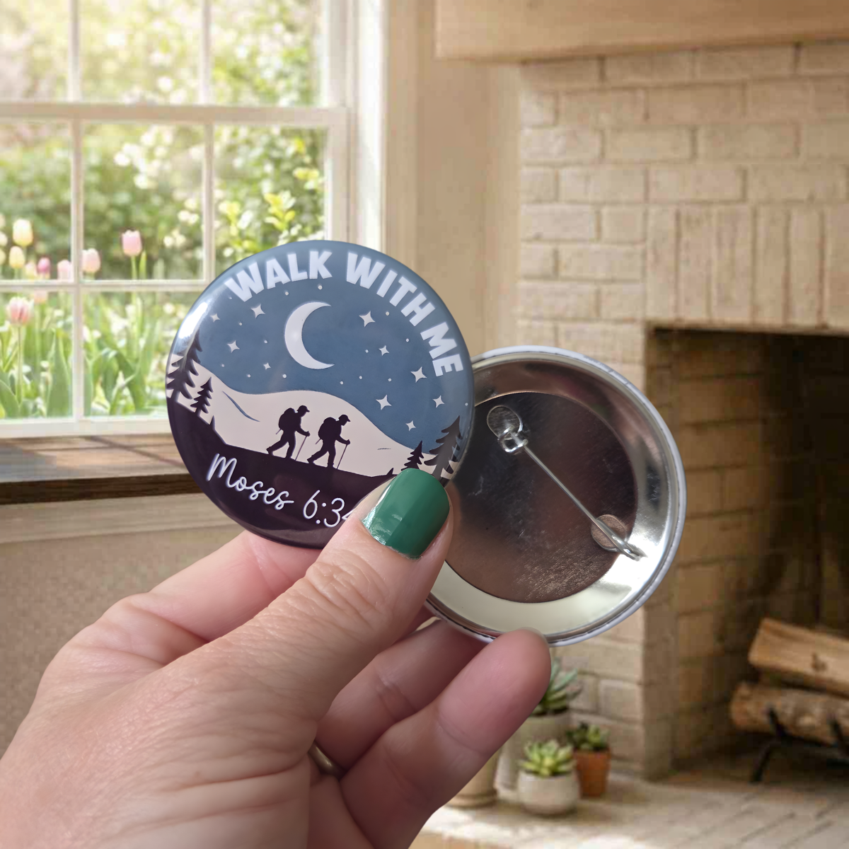 Button badge with 'Walk With Me' text held by a hand in a home setting.