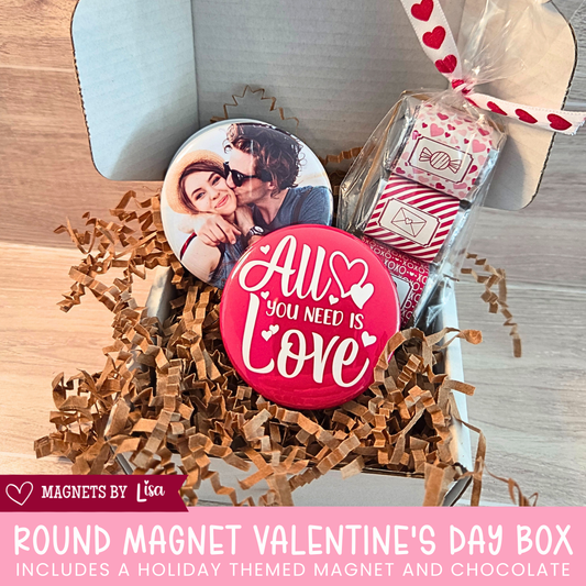 Valentine’s Day gift box with custom 2-inch round photo magnets, a All you Need is Love magnet, and a  trio of Hershey chocolate nuggets wrapped in pink and red Valentine-themed stickers.