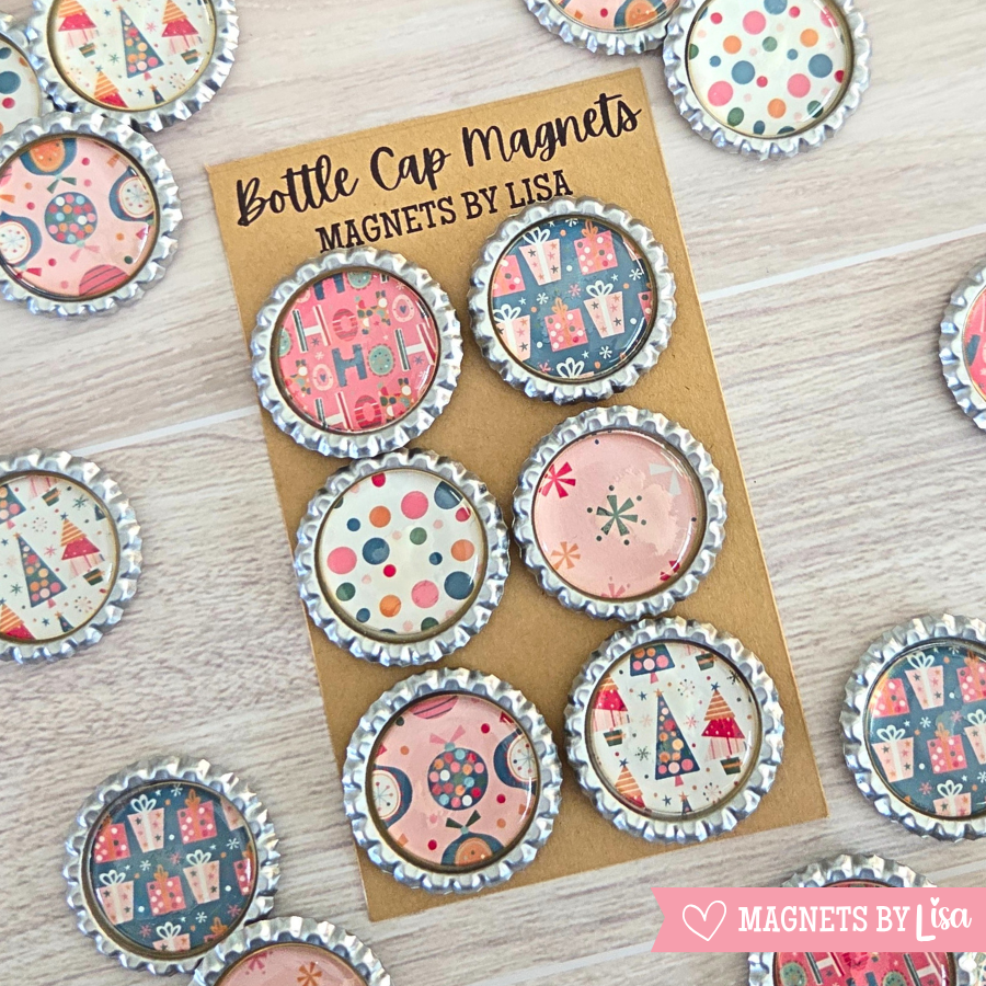 Bottle cap magnets by Lisa on a cardboard backing with decorative patterns.